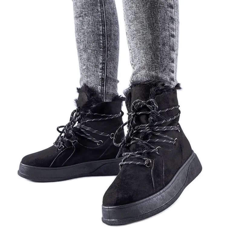Black snow boots on the Rancourt platform