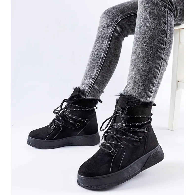 Black snow boots on the Rancourt platform